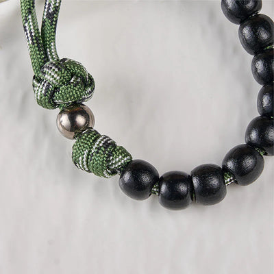 BlessingTree St. Benedict Pocket Rosary – Black Wood Beads with Green Paracord and Silver Crucifix